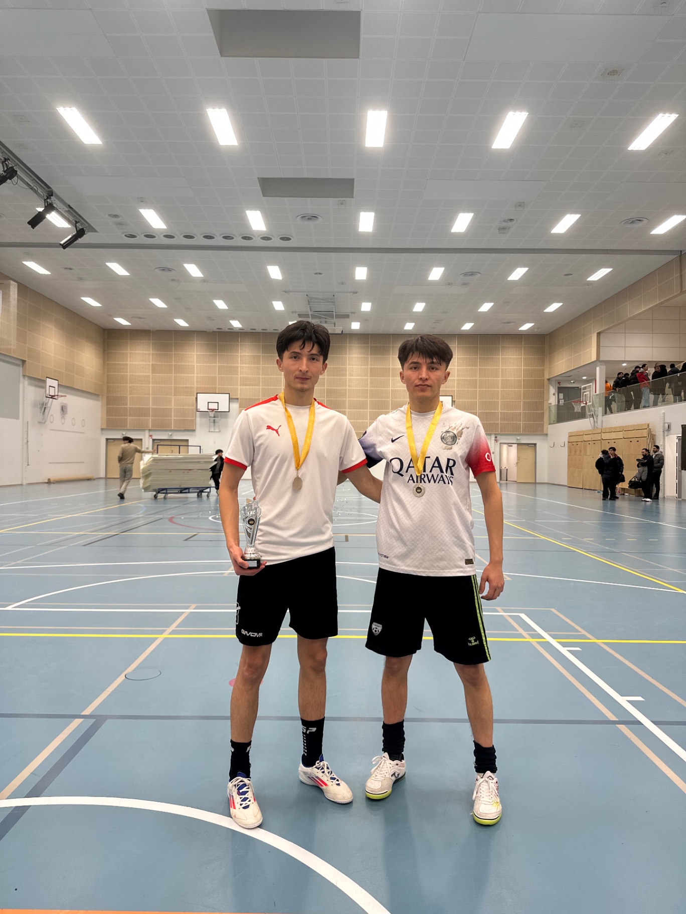 Two Shirdaghian FC players with the trophy after the final